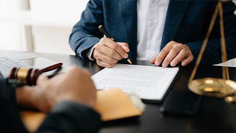 lawyer explaining paperwork to a client